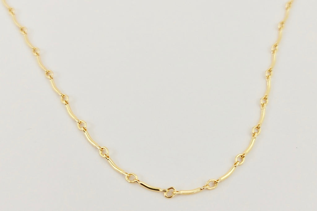 The gold curved bar layering necklace